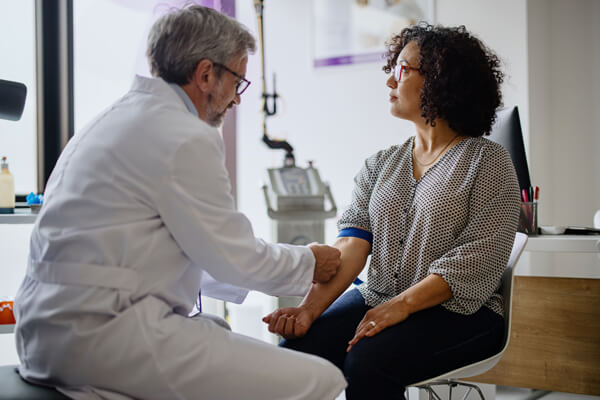 Primary Care doctor examining patient